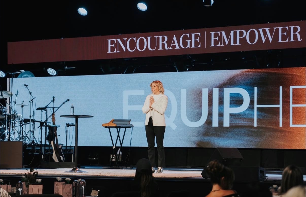 Carrie Pasch on stage at the EquipHer Conference